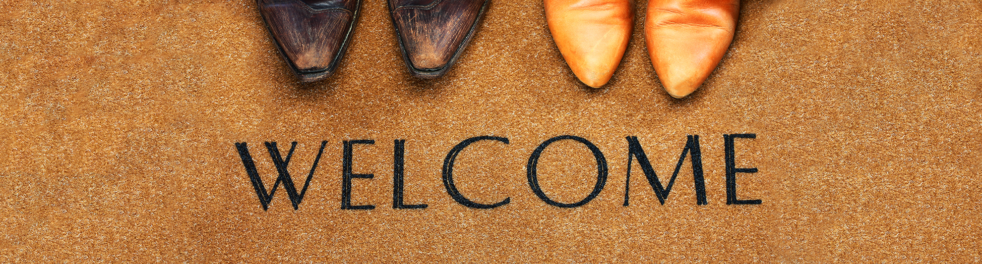 image of western boots on a welcome home door mat