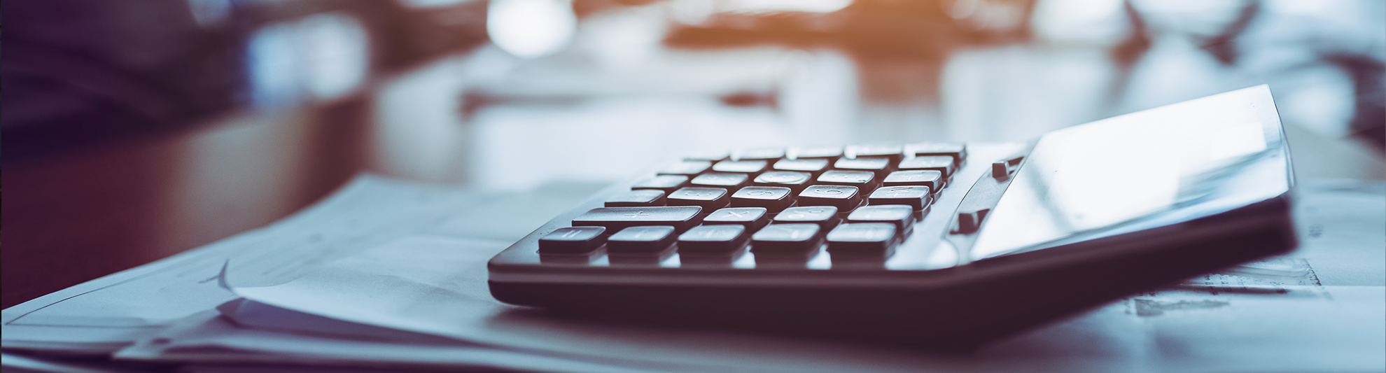 image of a calculator on a desk