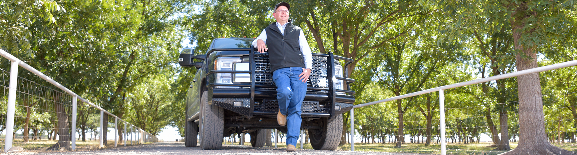 image of man in front of his pick up truck