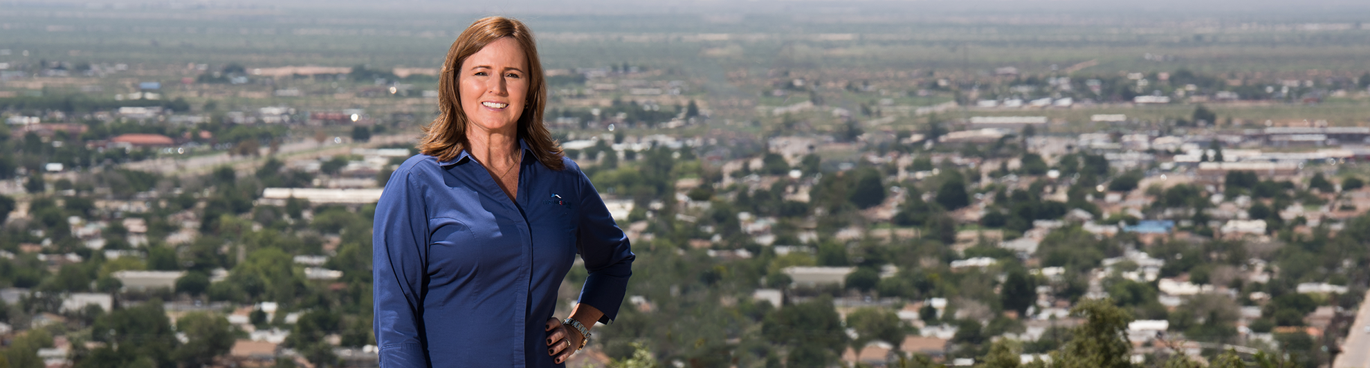 image of banker with Alamogordo, NM view in the background